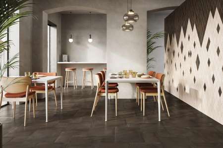 Restaurace s dlažbou Cerdomus Crete Bronzo položenou ve skladbě formátů