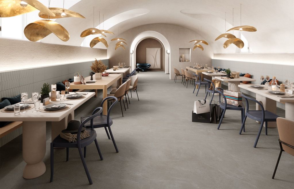 Realizace Šedá podlaha v moderní restauraci ze série Mirage Motley. 