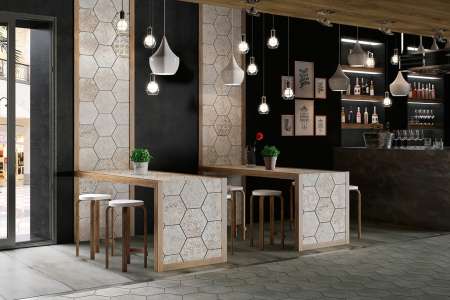 Dlažba a obklad ve tvaru hexagonu v restauraci ze série Aparici Carpet.