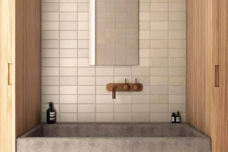 Netradiční koupelna s designovými prvky a béžovým obkladem Equipe Matelier